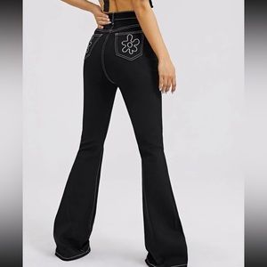 High rise flared jeans with black and white stitching